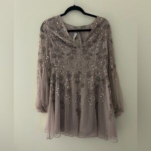 Embellished and beaded purple mini dress with long sleeves. Size US 8 NWT